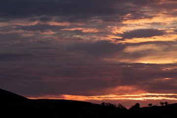 Obraz premium Amazing landscape during sunrise with a lot of colors on the clouds.