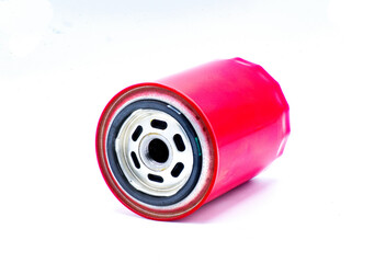 Oil Car filter generic isolated white background, red color closeup side view. Maintenance on auto...