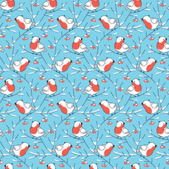 Vector seamless pattern. Winter birds bullfinches with red berries on snow-covered tree branches on a blue background. - 667696887
