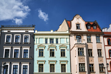 facades of a historic tenement houses in the city of Torun