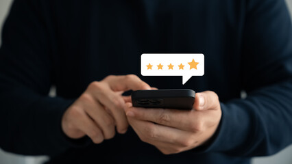 customer satisfaction survey concept business people use smartphone Touch the happy smiley icon. Satisfied. 5 stars. Service experience rating. online application Satisfaction Review best quality.