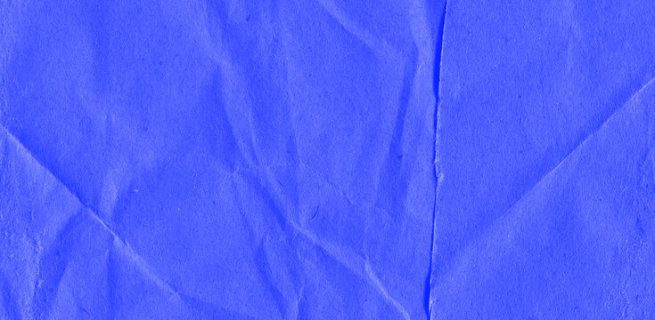 Recycled crumpled blue paper texture background. Royalty high-quality free stock photo image of Wrinkled and creased abstract backdrop, wallpaper with copy space, top view