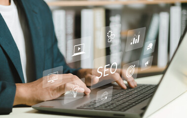 SEO Concept.Women using a computer with SEO icon for analysis SEO Search Engine optimizing your...