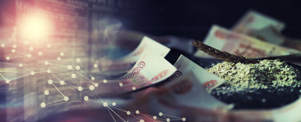 The concept of the cost of grain. 5000 ruble banknotes around a handful of ground grain. World...