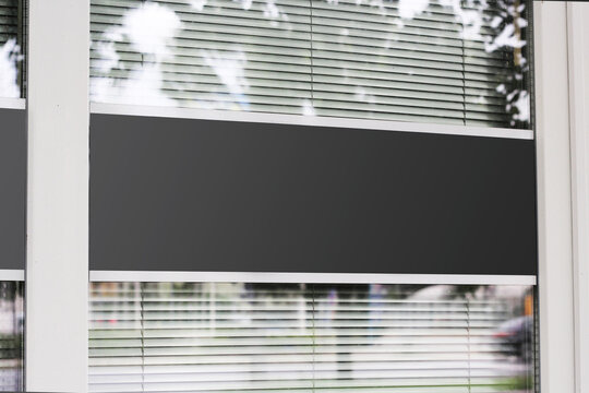 Large shop window with urban background reflection mockup template. Empty office window for business logo mock up template.