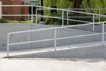 A wheelchair ramp. path way for support wheelchair disabled with handrail.