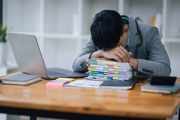 Businessman stressed from overwork and missed deadlines.