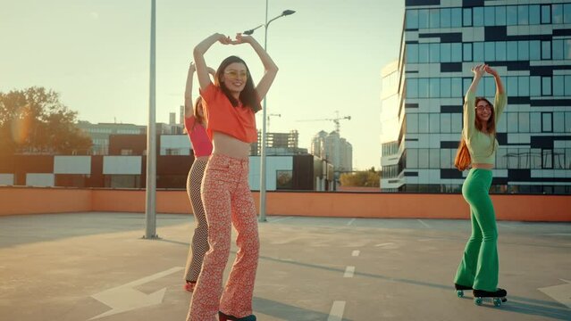 Active pin-up women gracefully moving in retro roller skates