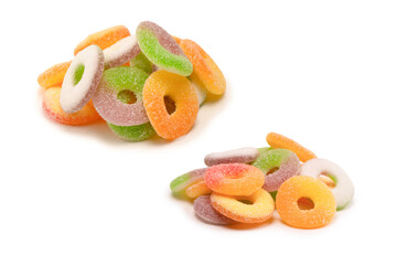 Assorted gummy candies isolated on a white background. Top view.
