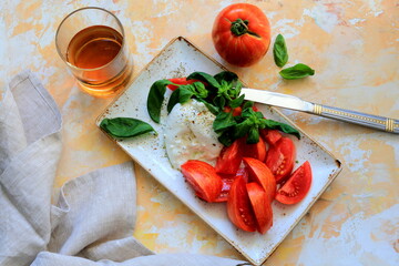 burrata cheese and tomatoes on a wooden table