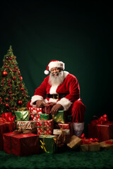 African American Santa Sitting in Midst of Many Gifts. Generative ai - 667726234