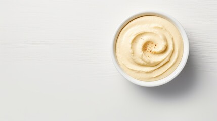 bowl of hummus on a white background, top view. vegetarian homemade snack. Arabic food. - obrazy, fototapety, plakaty