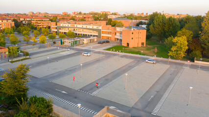 Aerial view of a parking lot at sunset.