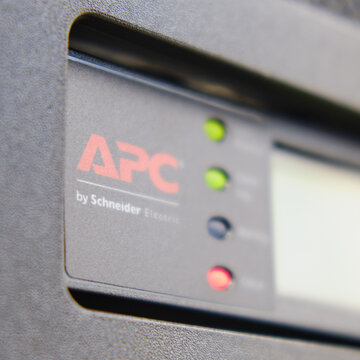 Control panel APC with alarm module of uninterruptible power supply system ups in server room, red light warning error - Moscow, Russia, 06, 02, 2022