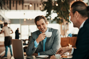 Business partners talking in a coffee shop