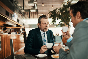 Business partners talking in a coffee shop