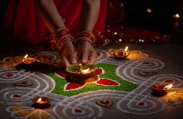 Clay diya lamps lit during diwali celebration, Diwali, or Deepavali, is India's biggest and most...