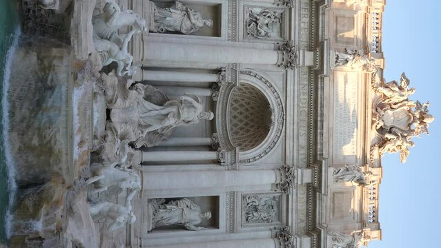 Vertical shot of Trevi Fountain in Italian language Fontana di Trevi is fountain in Trevi district designed by Italian architect Nicola Salvi and completed by Giuseppe Pannini, slow motion, nobody