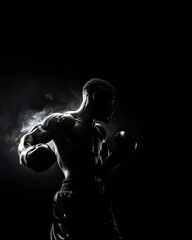 Fototapeta na wymiar muscular man trains in boxing, smoke emanates from the athlete's power, isolated on a black background, backlight highlights the silhouette of the athletic physique