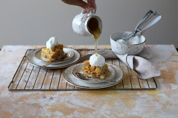 homemade apple crumble with vanilla ice cream
