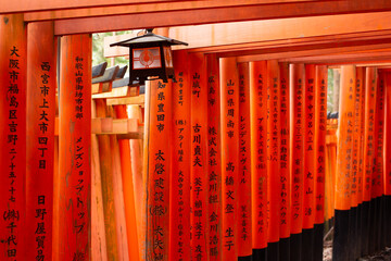 Torei and old lamp in Fushimi Inari Shrine