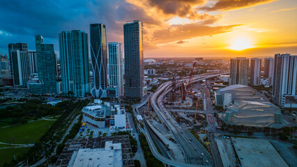 Naklejka premium aerial sunset of Miami Downtown Skyscrapers and Highway Traffic, USA