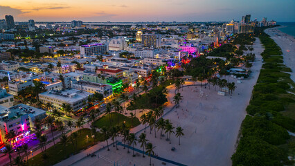 Miami aerial photo of south beach illuminated at night sunset with ocean drive road Florida usa 