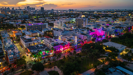 aerial of south beach during sunset with skyline cityscape and ocean road famous avenue