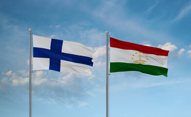 Tajikistan and Finland flags, country relationship concept