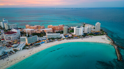 Cancun Mexico aerial at sunset of Caribbean Sea ocean resort tropical beach 