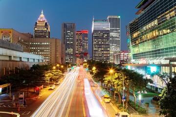 Nightscape of Downtown Taipei, the vibrant capital city of Taiwan, with high-rise office towers & busy traffic trails on the street in XinYi Financial District~Beautiful cityscape of Taipei after dark
