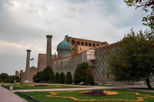 historical building in Samarkand with a flag in Uzbekistan