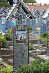 Fototapeta na wymiar Wesoły Cmentarz – cmentarz położony wokół cerkwi w rumuńskiej miejscowości Săpânța, w okręgu Marmarosz w północnej części Rumunii.