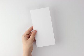 Card mockup in minimalist style, blank card in hand