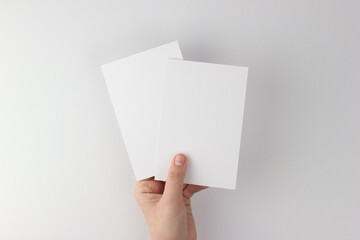 Card mockup in minimalist style, two blank cards in hand