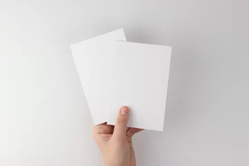 Foto op Aluminium Card mockup in minimalist style, two blank cards in hand © Vivi