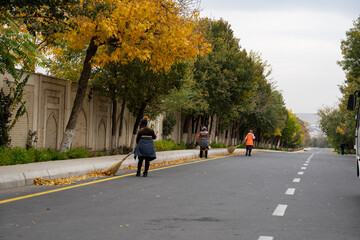 Uzbek women's are cleaning the highways in Uzbekistan