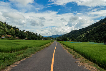 Country road or mountain middle road, Beautiful blue sky and cloud with green tree.