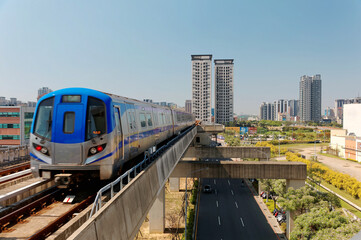 Scenic view of a metro train traveling on elevated rails of Taoyuan Mass Rapid Transit System...