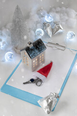 A house key as a holiday gift. Christmas or New Year background.