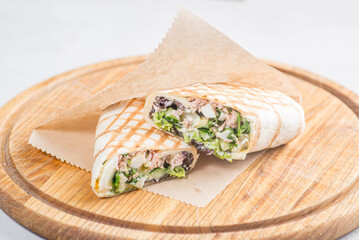 Pita roll with chicken and vegetables filling. Shawarma in pita bread stuffed with vegetables and meat