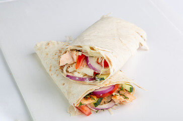 Pita roll with chicken and vegetables filling. Shawarma in pita bread stuffed with vegetables and...