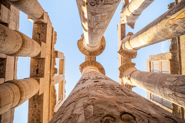 Stone columns of the Luxor Temple in ancient Thebes, Egypt, built under the 18th and 19th Egyptian dynasties, during a sunny day