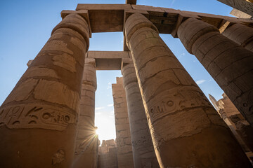 Stone columns of the Luxor Temple in ancient Thebes, Egypt, built under the 18th and 19th Egyptian...