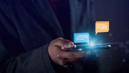  Hand using smartphone online typing chat with friend or service help show social media message chat box icon. Live chat chatting on application communication concept.