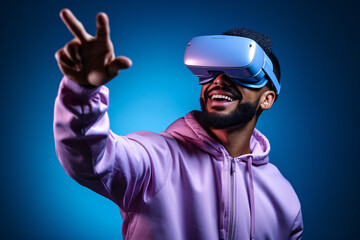 Young man with augmented reality headset interacting with virtual content on plain blue background. Advertising image with bright colors and high-impact volumetric lighting.