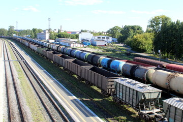 Freight trains are at the railway station.	