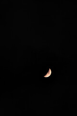 Concave crescent or crescent moon, isolated in a night sky in the southern hemisphere.