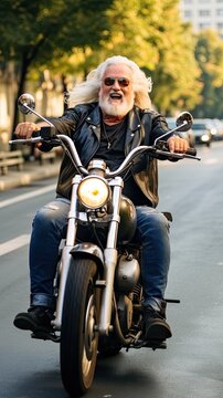 Senior man enjoy driving a motorbike, wearing a leather  jacket.