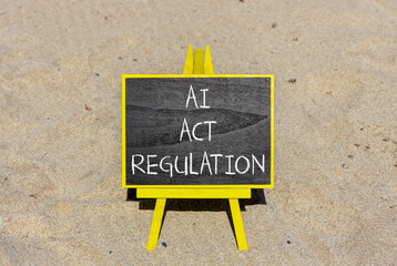 AI act regulation symbol. Concept words AI artificial intelligence act regulation on beautiful black chalk blackboard. Beautiful sand background. Business AI act regulation concept Copy space